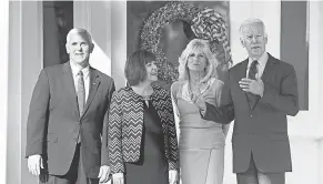  ?? CLIFF OWEN/ AP ?? The Bidens welcome Vice President- elect Mike Pence and his wife, Karen, to the Naval Observator­y on Nov. 16, 2016.