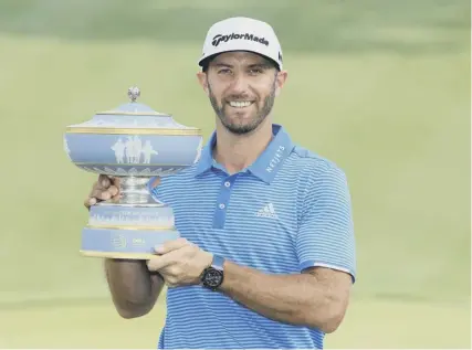  ??  ?? Dustin Johnson, with the WGC Dell Match Play trophy, is beginning to look invincible, just in time for The Masters.