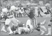  ?? FILE — THE ASSOCIATED PRESS ?? San Francisco 49ers defensive end Fred Dean (74) gets a hand on New York Giants running back Tony Galbreath (30) during the fourth quarter of the 49ers’ 21-10 win over the Giants during the first round of the NFC playoffs on Dec. 31, 1984, at Candlestic­k Park in San Francisco.