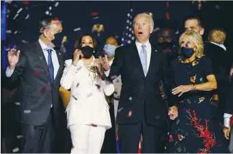  ?? ( Jim Bourg/ Reuters) ?? PRESIDENT- ELECT JOE BIDEN and his wife, Jill, and Vice President- elect Kamala Harris and her husband, Doug, attend their victory rally in Wilmington, Delaware, on November 7.