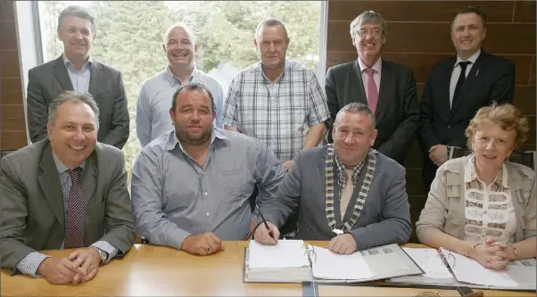  ??  ?? At the contract signing at council chambers in Enniscorth­y were, back row: Ken Jones, housing engineer; Cllr John O’Rourke, Cllr Willie Kavanagh, John Carley, director of services and James Brown TD. Front: Padraig O’Gorman, housing department, Wexford...