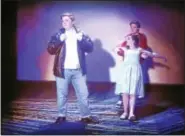  ??  ?? Mickey Gray (Conrad Birdie), Sarah Lala (Kim MacAfee), and Ben Daniels (Hugo Peabody) in a scene from “Bye Bye Birdie.”