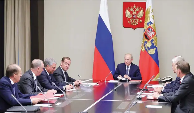  ?? Reuters ?? ↑ Vladimir Putin attends a meeting with members of the Security Council at the Novo-ogaryovo state residence outside Moscow on Monday.