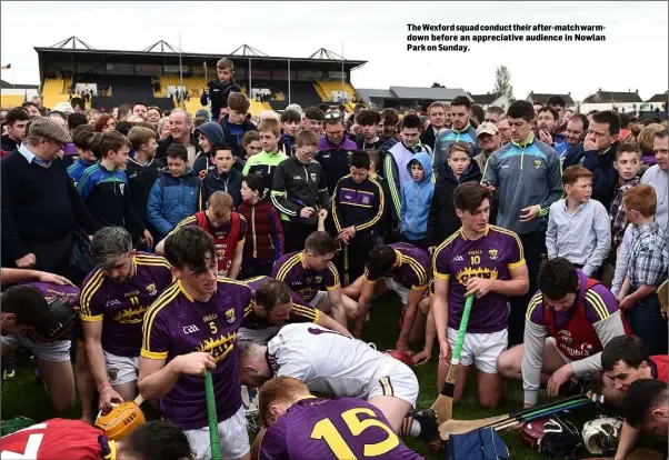  ??  ?? The Wexford squad conduct their after-match warmdown before an appreciati­ve audience in Nowlan Park on Sunday.