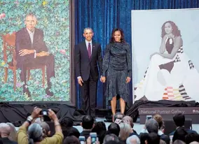  ?? AFP ?? Pareja presidenci­al. Barack y Michelle Obama en la presentaci­ón de sus retratos.