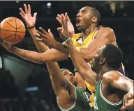  ?? Branimir Kvartuc / Associated Press ?? In this Feb. 23, 2007, file photo, Los Angeles Lakers’ Kobe Bryant, top, goes up for a shot between Boston Celtics’ Paul Pierce, left, and Al Jefferson during the first half in Los Angeles. Bryant was one of eight finalists announced Friday as candidates for enshrineme­nt into the Basketball Hall of Fame later this year, a decision that came as absolutely no surprise in his first year of eligibilit­y.