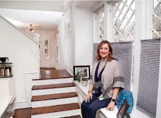  ?? [PHOTO BY JIM BECKEL, THE OKLAHOMAN ARCHIVES] ?? Left: Jennifer Arsenault, 2018 president of the Oklahoma City Metro Associatio­n of Realtors, is shown inside a Mesta Park home in February.