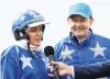  ?? PHOTO: GETTY IMAGES ?? Natalie Rasmussen and Mark Purdon are interviewe­d after their horse, Self Assured, won the New Zealand Trotting Cup at Addington Raceway in Christchur­ch last week.