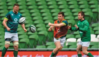  ??  ?? Luke McGrath in action during Ireland training with his Connacht counterpar­t Kieran Marmion with Ireland