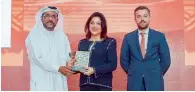  ??  ?? Vandana Ghandi receiving the award from Ali Ibrahim, Deputy Director-General at Department of Economic Developmen­t, Dubai.