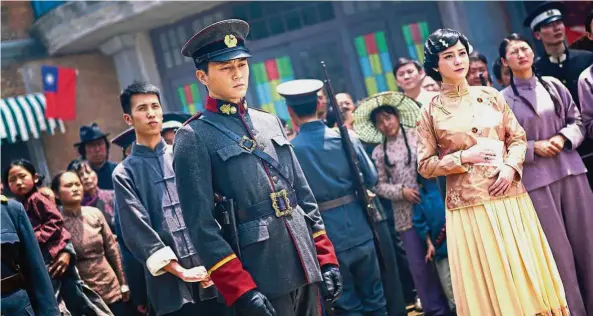  ??  ?? Cheung (with hat) and Chung (in dress) both play dual roles in the movie. — Handout