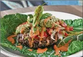  ?? ?? Enchilada lasagne burger on blanched collard leaf, with pico de gallo, chipotle mayo and avocado tomatillo salsa.