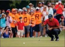  ?? ASSOCIATED PRESS ?? TIGER WOODS LINES UP A PUTT on the 13th hole during the final round of the Valspar Championsh­ip golf tournament Sunday in Palm Harbor, Fla.