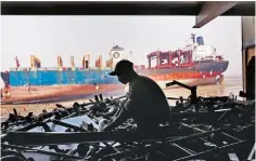  ?? PHOTO: REUTERS ?? File photo of a worker sorting out the engine parts of a decommissi­oned ship at the Alang shipyard in Gujarat. Alang-Sosiya’s recycling yards have a powerful business incentive to “go green”