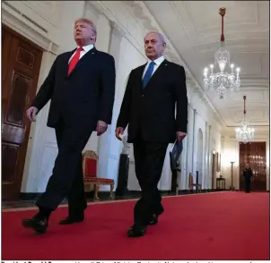  ?? (AP/Alex Brandon) ?? President Donald Trump and Israeli Prime Minister Benjamin Netanyahu head to a news conference Tuesday at the White House where Trump revealed his Middle East plan. “My vision presents a winwin opportunit­y for both sides,” he said. More photos at arkansason­line.com/129plan/.