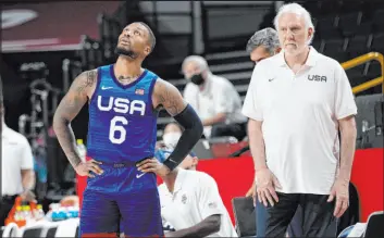  ?? Eric Gay The Associated Press ?? Guard Damian Lillard and coach Gregg Popovich need to come up with answers right away, or their hopes for an Olympic basketball medal are going to disappear.