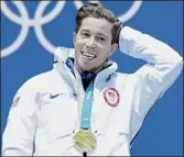  ?? Andreas Rentz / Getty Images ?? Gold medalist Shaun White of the U.S. poses during the medal ceremony for the Snowboard Men’s Halfpipe Final at the Pyeongchan­g 2018 Winter Olympics at Medal Plaza in South Korea.