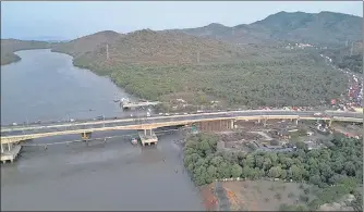  ?? HT PHOTO ?? The National Highways Authority of India (NHAI) on Monday opened a four-lane bridge on Vasai creek connecting Mumbai to Surat on National Highway 48. The bridge was built at a cost of ₹157 crore. The Surat to Mumbai arm of the bridge will be opened before monsoon. This would provide a relief from traffic jams across the creek on the Mumbai-surat corridor.