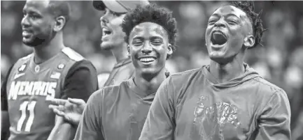  ?? MARK WEBER, THE COMMERCIAL APPEAL ?? Jayden Hardaway (middle) and Kyvon Davenport (right) during Memphis Madness at the FedExForum Thursday evening.