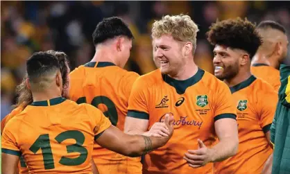  ?? Photograph: Darren England/ AAP ?? Matt Philip and Wallabies teammates celebrate Australia’s upset of France in their opening Test of 2021.