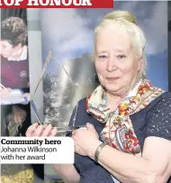  ??  ?? Community hero Johanna Wilkinson with her award