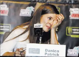  ?? Darryl Graham The Associated Press ?? Danica Patrick wipes away tears as he speaks with the media during a news conference Friday at Homestead-miami Speedway in Homestead, Fla. Patrick will end her full-time racing career after running in next year’s Daytona 500 and Indianapol­is 500.