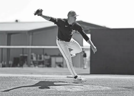  ?? JUNFU HAN/DETROIT FREE PRESS ?? Detroit Tigers pitcher Tarik Skubal throws during spring training at TigerTown in Lakeland, Fla., on Feb. 20.