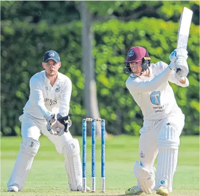  ?? Picture: Ian Potts. ?? Forfarshir­e’s Michael Leask on his way to an unbeaten 67 from 61 balls watched by Arbroath wicketkeep­er and captain Marc Petrie.