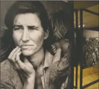  ?? The Associated Press ?? IMAGES: In this photo taken May 11, the iconic photograph Migrant Mother looks out at the exhibit "Dorothea Lange: Politics of Seeing," at the Oakland Museum of California in Oakland, Calif. The three major themes of the Lange display are the Great...