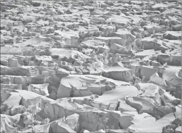  ?? ASSOCIATED PRESS ?? THIS 2010 PHOTO PROVIDED by researcher Ian Joughin shows crevasses near the edge of Pine Island Glacier, Antarctica. In a study released Wednesday, June 13, 2018, an internatio­nal team of ice experts said the melting of Antarctica is accelerati­ng at an...