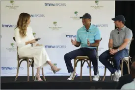  ?? WILFREDO LEE — THE ASSOCIATED PRESS ?? Golfers Tiger Woods, center, and Rory Mcilroy, right, talk to host Erin Andrews as they discuss the future home of their tech-infused golf league that will begin play next year.