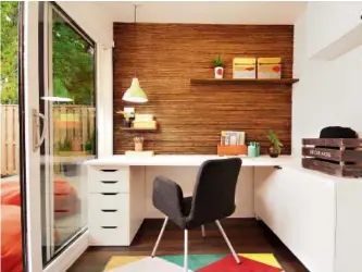  ??  ?? Sarah Keenleysid­e, interior designer and co-host of HGTV’s Backyard Builds, creates a clean, modern, Scandinavi­aninspired feel in this home office (built from a shipping container), warming it up with colour and lots of light.