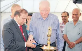  ??  ?? New beginnings: Bhartiya Samaj chairman Jeet Suchdev, left, and former deputy mayor Dr Bruce Hucker light the lamps at the launch of the Aashirwad wing. The practice signifies lighting the path towards a new beginning.