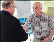  ?? SEAN D. ELLIOT/THE DAY ?? Current Stonington Water Pollution Control Authority Chairmain James Sisk, left, embraces former WPCA Director Harold Storrs on Thursday during a ceremony dedicating the Mystic Water Pollution Control Facility upgrades in Storrs’ name to commemorat­e...