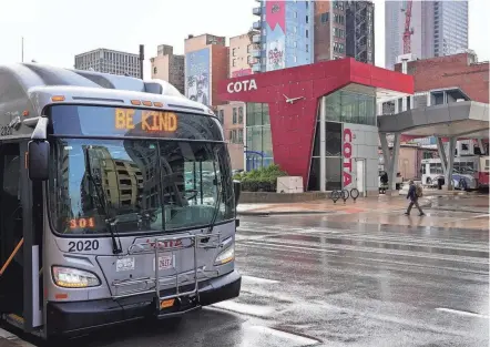  ?? ?? COTA buses pick up and drop off at the Downtown Spring Street terminal.