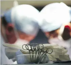  ?? CHRISTOPHE­R FURLONG / GETTY IMAGES ?? The busy operating room schedules at hospitals can lead to tragedies, says a patient safety investigat­or.