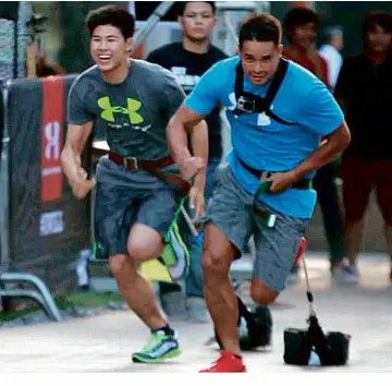  ??  ?? IT’S SWIMMING versus rugby as pool ace Johan Aguilar goes head-to-head against Philippine Volcanoes team captain Harry Morris.