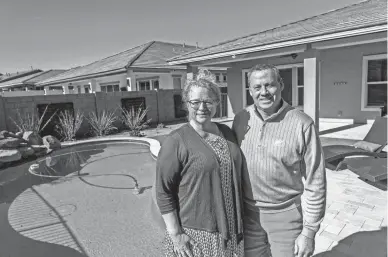  ?? JOEL ANGEL JUAREZ/THE REPUBLIC ?? Cindy and Scott Fisher were hooked on the 2,731-square-foot home with a “Frank Lloyd Wright” flair to it. They closed on the home in December and moved in later that month.