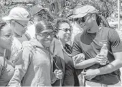  ?? Jon Shapley / Houston Chronicle ?? Ruth Simmons, center, the new president of Prairie View A&M University, laughs with Miles Carter, right, and Breon Holmes, front left, in April.