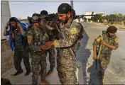  ?? HUSSEIN MALLA — THE ASSOCIATED PRESS FILE ?? U.S.-backed Syrian Democratic Forces fighters prepare for battle against Islamic state group militants in Raqqa, northeast Syria, on June 22, 2017.