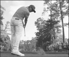  ?? Associated Press ?? Rickie Fowler hits his tee shot on the sixth hole during a practice round in preparatio­n for the Masters golf tournament at Augusta National Golf Club, Wednesday, in Augusta, Ga.