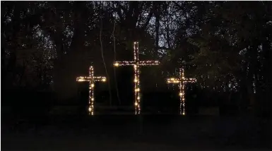  ?? MEGAN DAVIS MCDONALD COUNTY PRESS ?? Each year, those passing by Jerry and Debbie Dover’s house at 505 S. Broadway in Southwest City are graced with the sight of three, towering crosses. Duwayne Womack crafted the landmark pieces for the couple the better part of a decade ago.