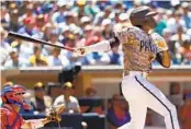  ?? K.C. ALFRED U-T ?? Padres shortstop C.J. Abrams hits a two-run double in the third inning against the Phillies at Petco Park.