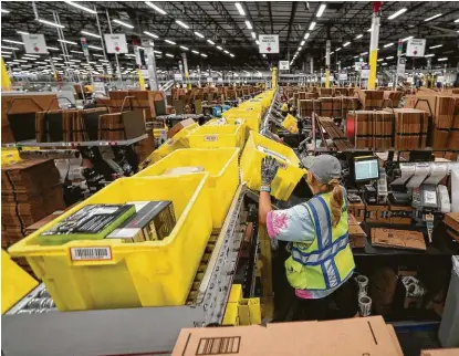  ?? Jon Shapley / Staff photograph­er ?? E-commerce giants such as Amazon and brick-and-mortar spaces have found common ground, and the region’s industrial real estate market is booming with warehouse spaces.