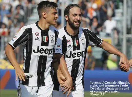  ??  ?? Juventus' Gonzalo Higuain, right, and teammate Paulo Dybala celebrate at the end of yesterday’s match Photo: AP