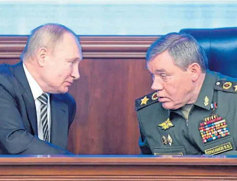  ?? ?? CRITICISED: President Vladimir Putin pictured in discussion­s with one of his generals, Valery Gerasimov.