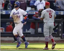  ?? ADAM HUNGER — THE ASSOCIATED PRESS ?? The Mets’ Pete Alonso runs past Cardinals first baseman Albert Pujols after hitting a winning two-run homer during the 10th inning on Thursday.