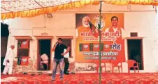  ?? Hamza Khan ?? While they contested against each other in 2019, Rahul Kaswan and Rafique Mandelia stand on either end of a Cong poster at party’s LS office in Churu; and (right) unlike Cong’s office, BJP’S Churu LS office is more organised and bustling.