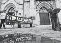  ?? William Luther / San Antonio Express-News ?? MacArthur Park Lutheran Church senior pastor Paul Ziese speaks Tuesday in Main Plaza on San Antonio, calling for a new trial for Christophe­r Anthony Young, who is scheduled to be executed July 17 for the 2004 murder of Hasmukh Patel.