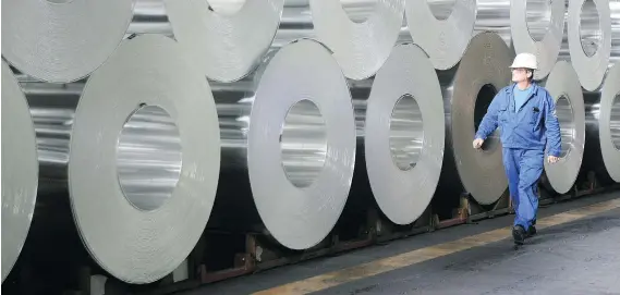  ?? SEAN GALLUP/GETTY IMAGES FILES ?? Following a steep decline in U.S. smelting capacity, the U.S. tariffs are unlikely to deliver a blow to Canadian producers, which supply 47 per cent of the aluminum consumed in the U.S., analysts say. “There’s no way the U.S. is or can be...